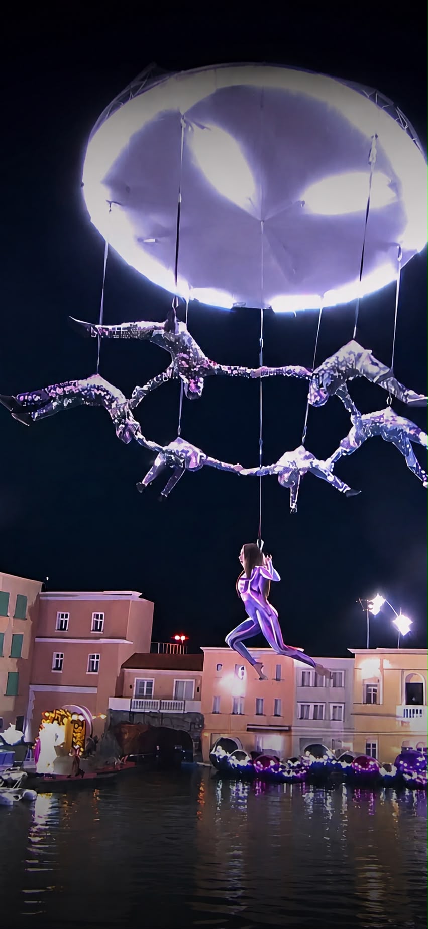 Aerial performers in a night-time water spectacular